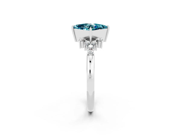 Silver Princess Cut Blue Topaz Ring with Side Stones and Four-Prong Setting
