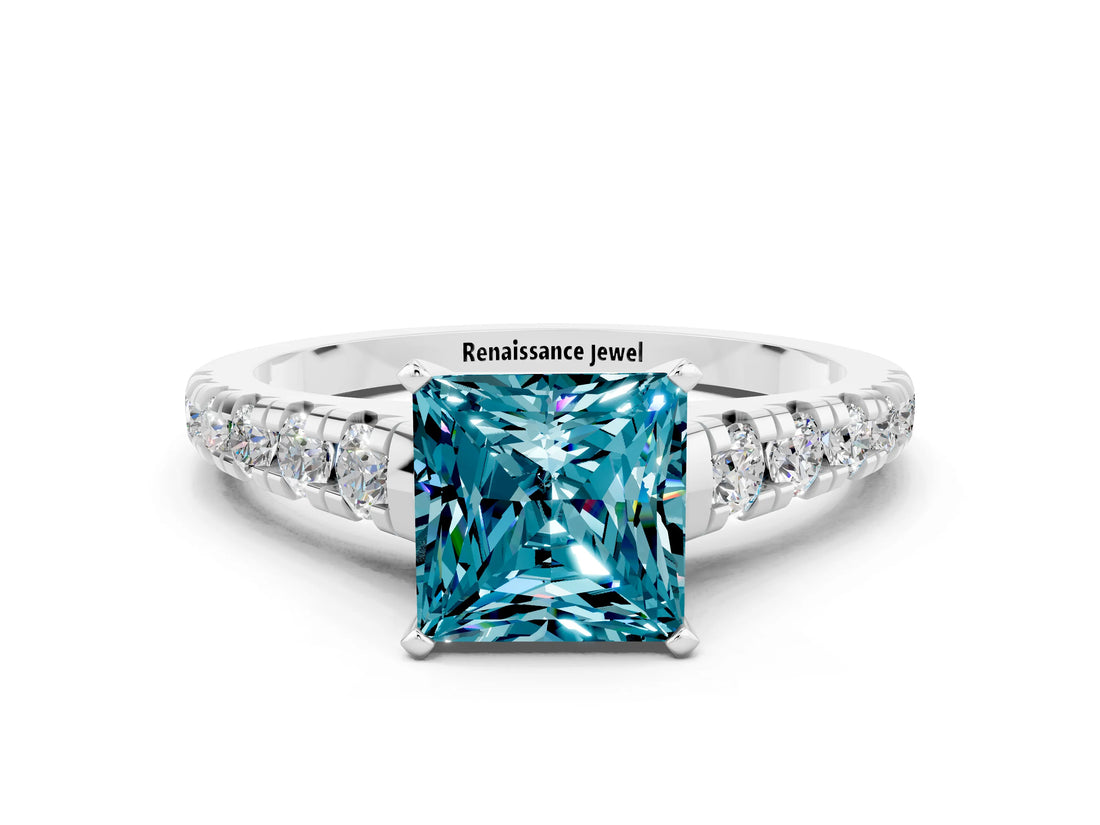 White gold Princess Cut Blue Topaz Solitaire Ring with Cathedral Setting and Pavé Band