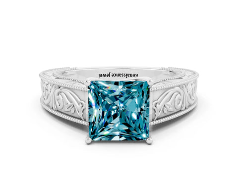 White gold Princess Cut Blue Topaz Solitaire Ring with Engraved Band and Four-Prong Setting