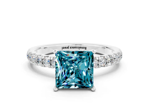 White gold Princess Cut Blue Topaz Solitaire Ring with Pavé Accents and Four-Prong Setting
