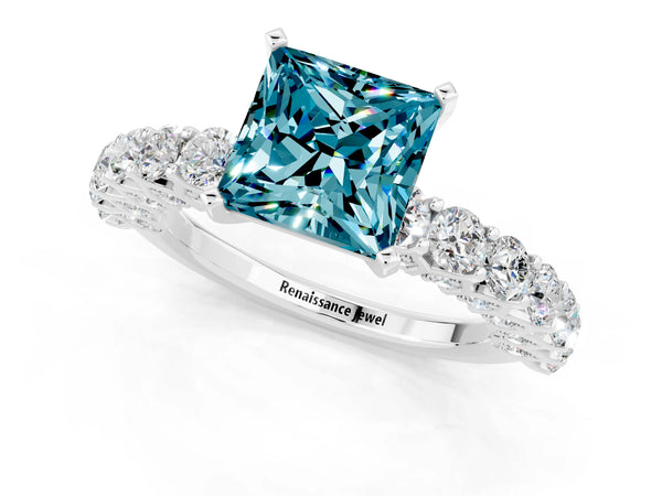 Silver Princess Cut Blue Topaz Solitaire Ring with Shared Prong Pavé Band and Four-Prong Setting