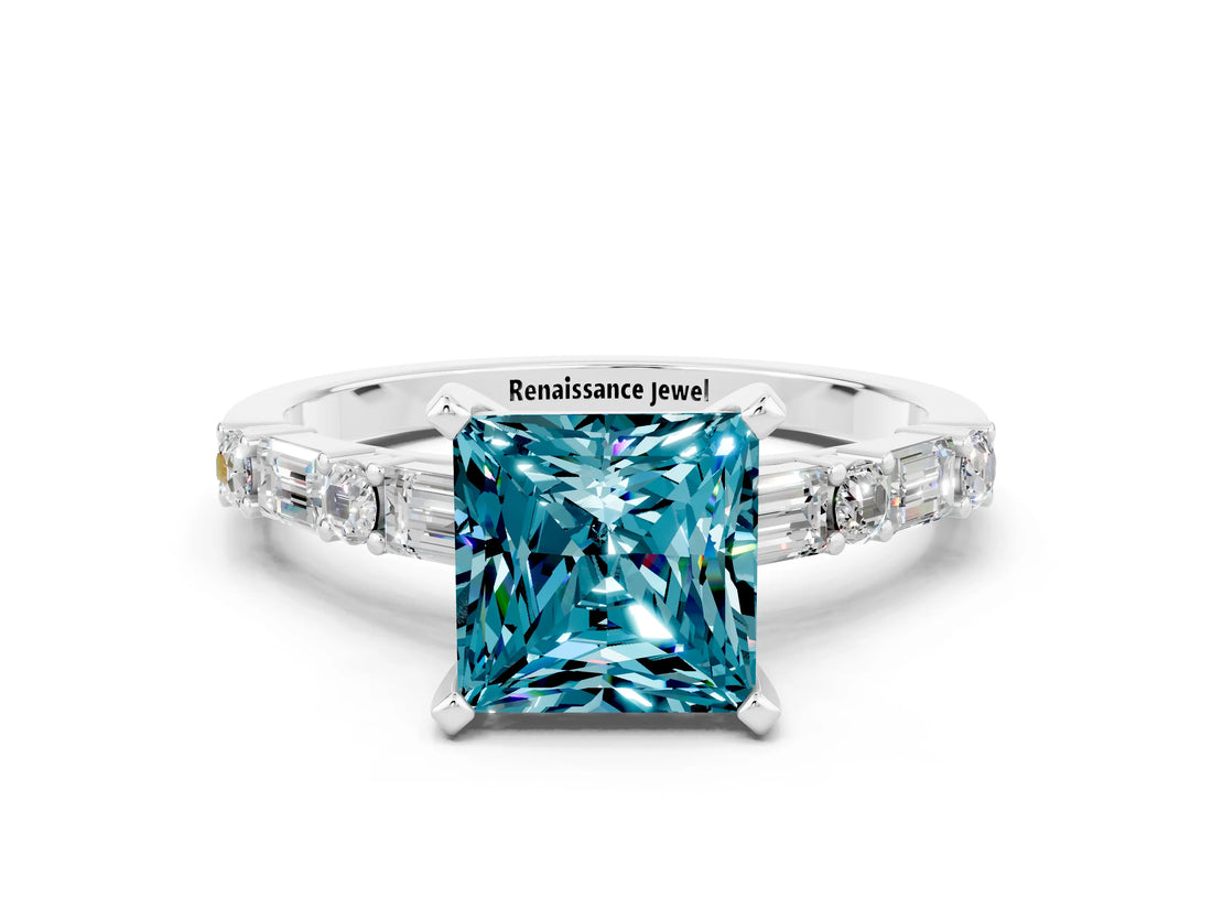 White gold Princess Cut Blue Topaz Solitaire with Side Baguettes and Channel Set Band