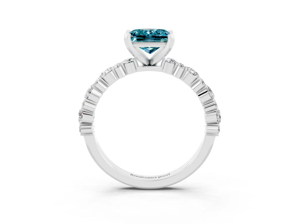 Platinum Princess Cut Blue Topaz Side Stone Solitaire Ring with Round  and Four-Prong Setting