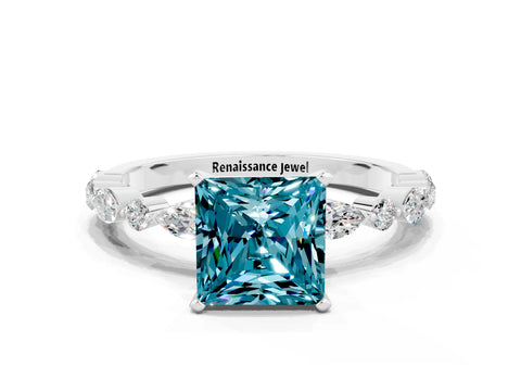 White gold Princess Cut Blue Topaz Solitaire with Side Stones on a Pavé Band and Four-Prong Setting
