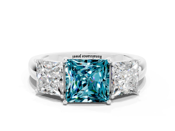 Platinum Princess Cut Blue Topaz Three-Stone Ring with Four-Prong Setting and Classic Band