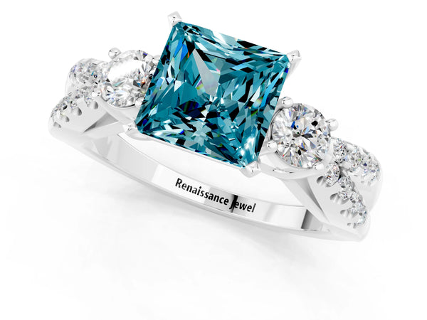 Silver Princess Cut Blue Topaz Three-Stone Ring with Pavé Split Shank and Four-Prong Setting