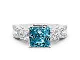 White gold Princess Cut Blue Topaz Three-Stone Ring with Pavé Split Shank and Four-Prong Setting