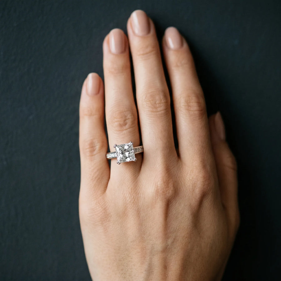 White gold Princess Cut Channel Set Solitaire Engagement Ring with Prong Setting