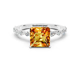 White gold Princess Cut Citrine Solitaire with Side Stones on a Pavé Band and Four-Prong Setting