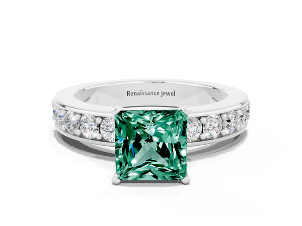 Platinum Princess Cut Green Sapphire Engagement Ring with Channel Set Round Band and Prong Setting