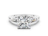 White gold Princess Cut Cut Diamond Ring with Tapered Baguette Side Stones in Four-Prong Setting