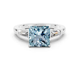 White gold Princess Cut Cut Diamond Ring with Tapered Baguette Side Stones in Four-Prong Setting