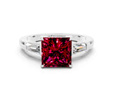 White gold Princess Cut Cut Diamond Ring with Tapered Baguette Side Stones in Four-Prong Setting