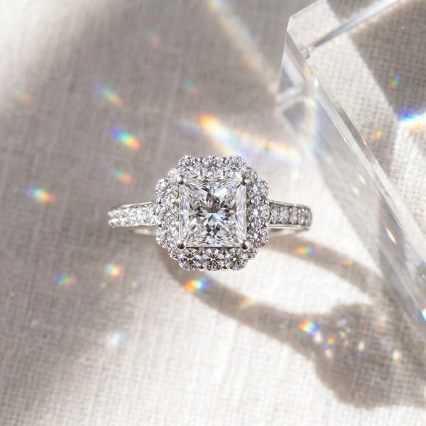 White gold Princess Cut Diamond Floral Halo Engagement Ring with Pavé Band and Four-Prong Setting