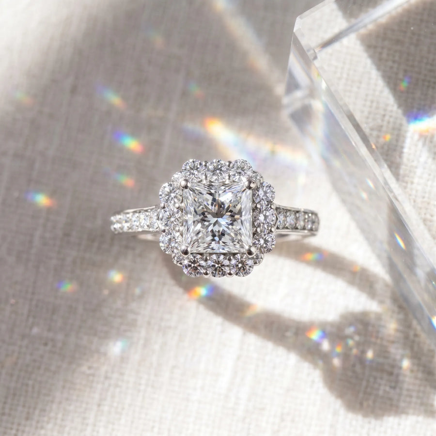 White gold Princess Cut Diamond Floral Halo Engagement Ring with Pavé Band and Four-Prong Setting
