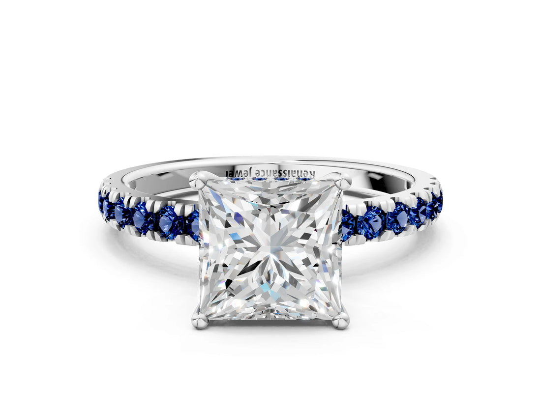 White gold Princess Cut Diamond Pave Band Solitaire Ring with Round with Blue Sapphire side stone and Prong Setting