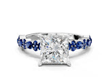 White gold Princess Cut Diamond Side Stone Solitaire Ring with Round with Blue Sapphire side stone and Four-Prong Setting