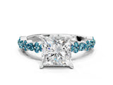 White gold Princess Cut Diamond Side Stone Solitaire Ring with Round with Blue Topaz side stone and Four-Prong Setting