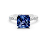 White gold Princess Cut Diamond Solitaire Ring with Four-Prong Setting and Pavé Band