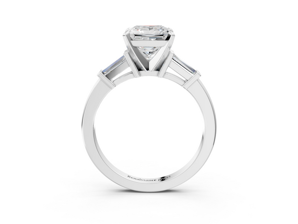 White gold Princess Cut Diamond Solitaire Ring with Tapered Baguette Accents and Four-Prong Setting