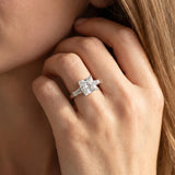 White gold Princess Cut Diamond Solitaire Ring with Tapered Baguette Accents and Four-Prong Setting_135