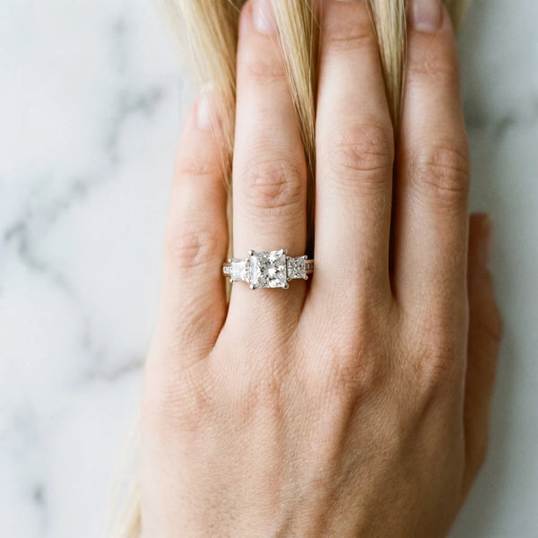 10K White Gold 3.13 Carat E VS1 Princess Diamond Three-Stone Ring with Channel Set Band and Four-Prong Setting