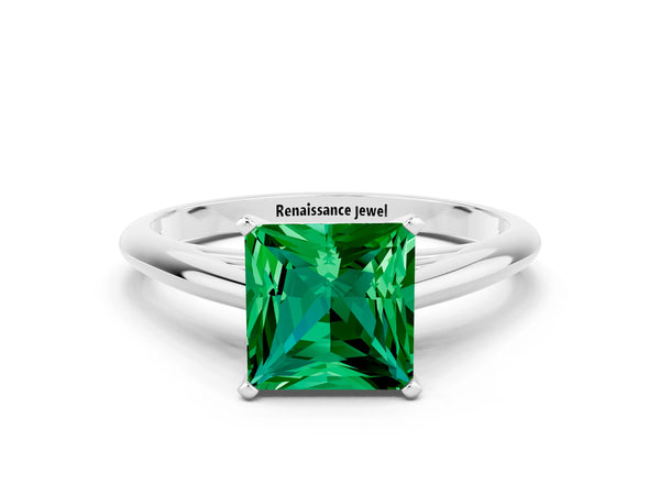 White gold Princess Cut Emerald Solitaire Engagement Ring with Cathedral Setting and Four-Prong Mount