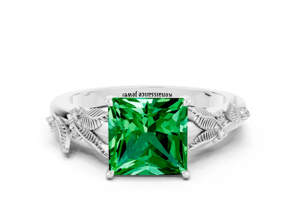 Platinum Princess Cut Emerald Solitaire Ring with Leaf Motif Band and Four-Prong Setting