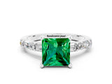 White gold Princess Cut Emerald Solitaire with Side Baguettes and Channel Set Band