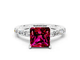 White gold Princess Cut Garnet Solitaire with Side Baguettes and Channel Set Band