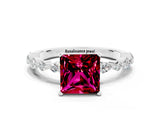 White gold Princess Cut Garnet Solitaire with Side Stones on a Pavé Band and Four-Prong Setting