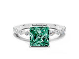 White gold Princess Cut Green Sapphire Solitaire with Side Stones on a Pavé Band and Four-Prong Setting