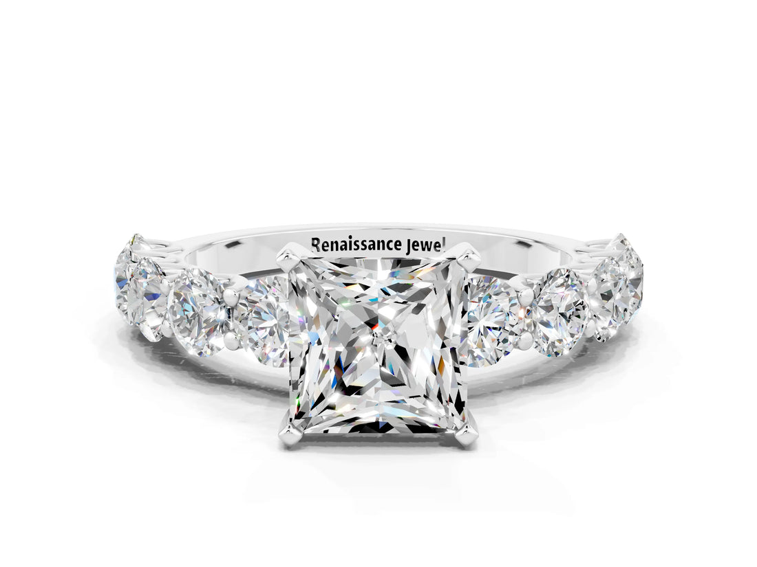 White gold Princess Cut Moissanite Prong Setting with Side Stones on a Pave Band