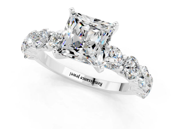 White gold Princess Cut Moissanite Prong Setting with Side Stones on a Pave Band