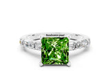 White gold Princess Cut Peridot Solitaire with Side Baguettes and Channel Set Band