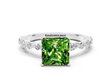 White gold Princess Cut Peridot Solitaire with Side Stones on a Pavé Band and Four-Prong Setting
