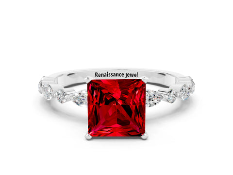White gold Princess Cut Ruby Solitaire with Side Stones on a Pavé Band and Four-Prong Setting