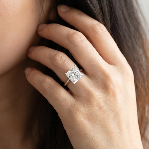 White gold Princess Cut Solitaire Engagement Ring with Thin Band and Four-Prong Setting