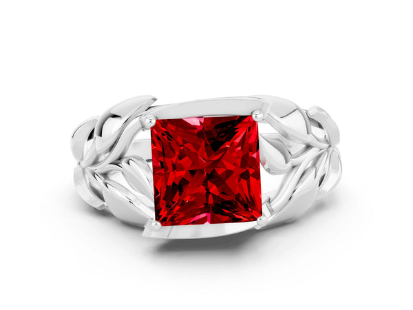 Platinum Princess Cut Ruby Leaf-Inspired Engagement Ring with Round Accents and Prong Setting