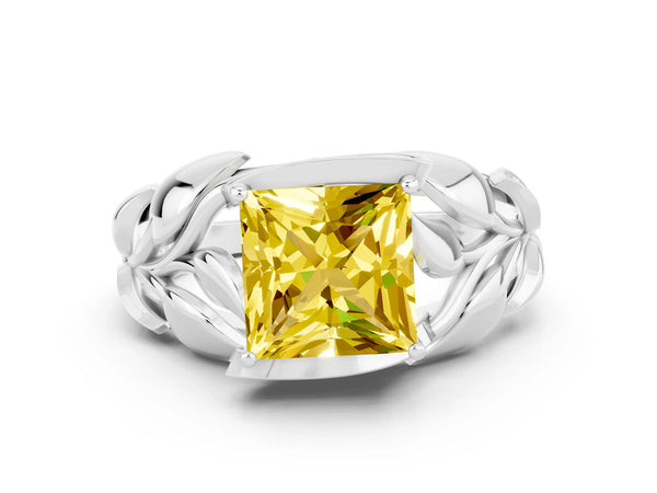 Silver Princess Cut Yellow Sapphire Leaf-Inspired Engagement Ring with Round Accents and Prong Setting