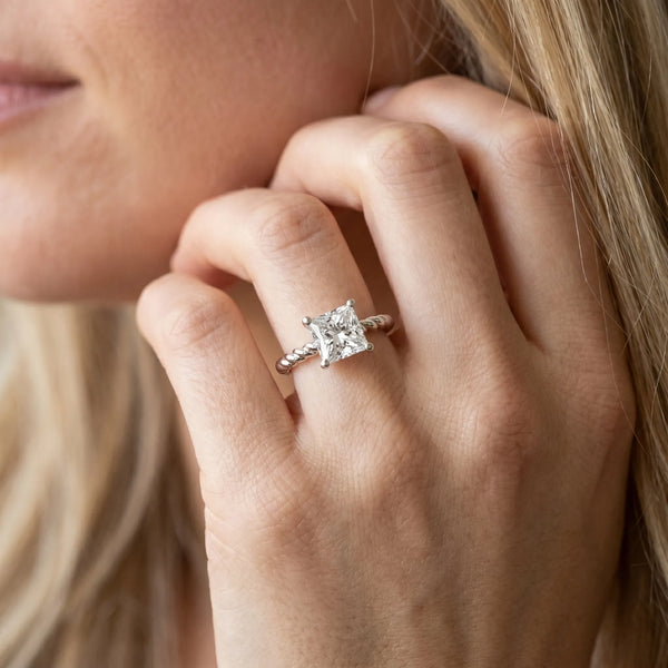 White gold Princess Cut Solitaire Twisted Band Ring with Four-Prong Setting