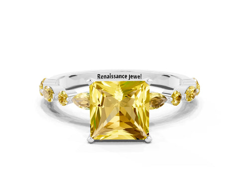 White gold Princess Cut Yellow Sapphire Solitaire with Side Stones on a Pavé Band and Four-Prong Setting