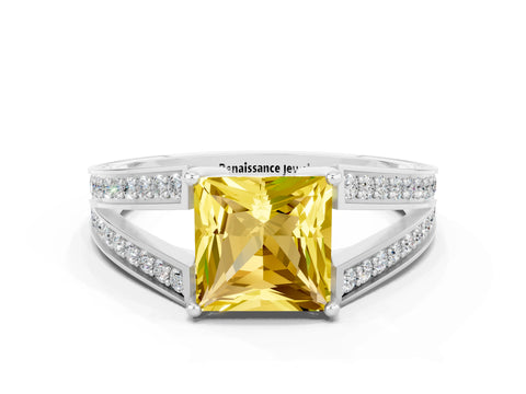 White gold Princess Cut Yellow Sapphire Split Shank Ring with Pavé Band and Four-Prong Setting