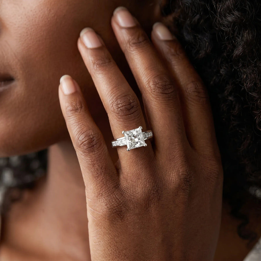 White gold Princess Diamond Engagement Ring with Channel Set Princess Side Stones and Four Prong Setting