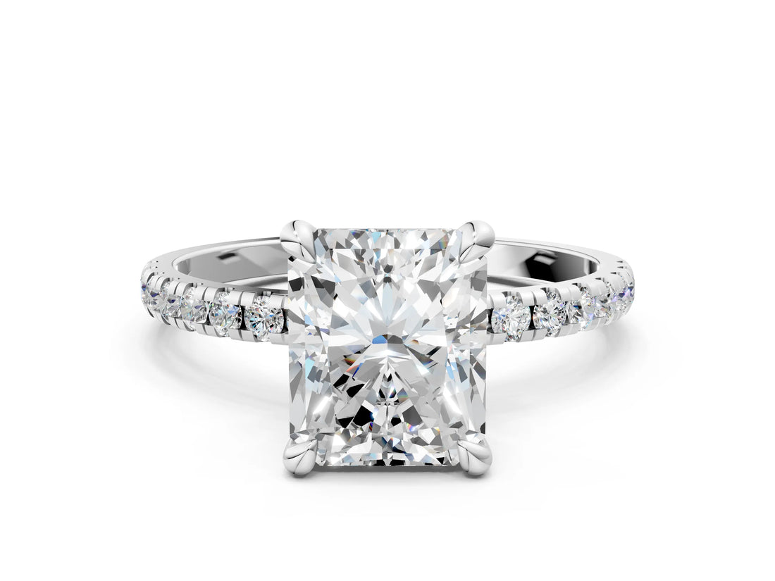White gold Radiant Cut Diamond Brilliant Solitaire Ring with Pavé Band and Four-Prong Setting