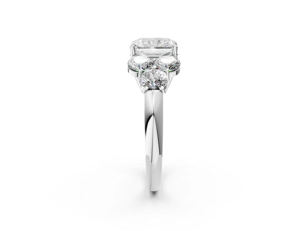 Platinum Radiant Cut Diamond Cluster Ring with Round Accent Stones and Prong Setting on a Classic Band