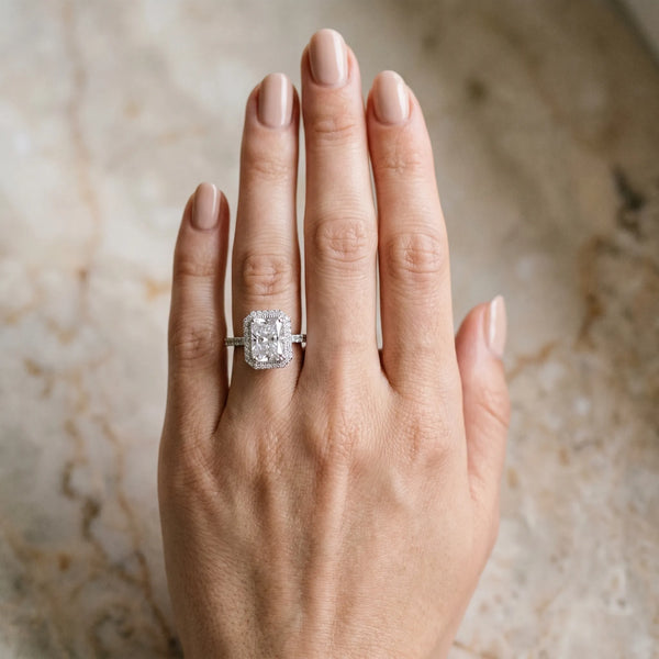 White gold Radiant Cut Diamond Halo Engagement Ring with Milgrain Detail and Pavé Band