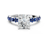 White gold Radiant Cut Diamond Side Stone Solitaire Ring with Round with Blue Sapphire side stone and Four-Prong Setting