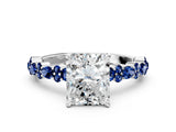 White gold Radiant Cut Diamond Side Stone Solitaire Ring with Round with Blue Sapphire side stone and Four-Prong Setting