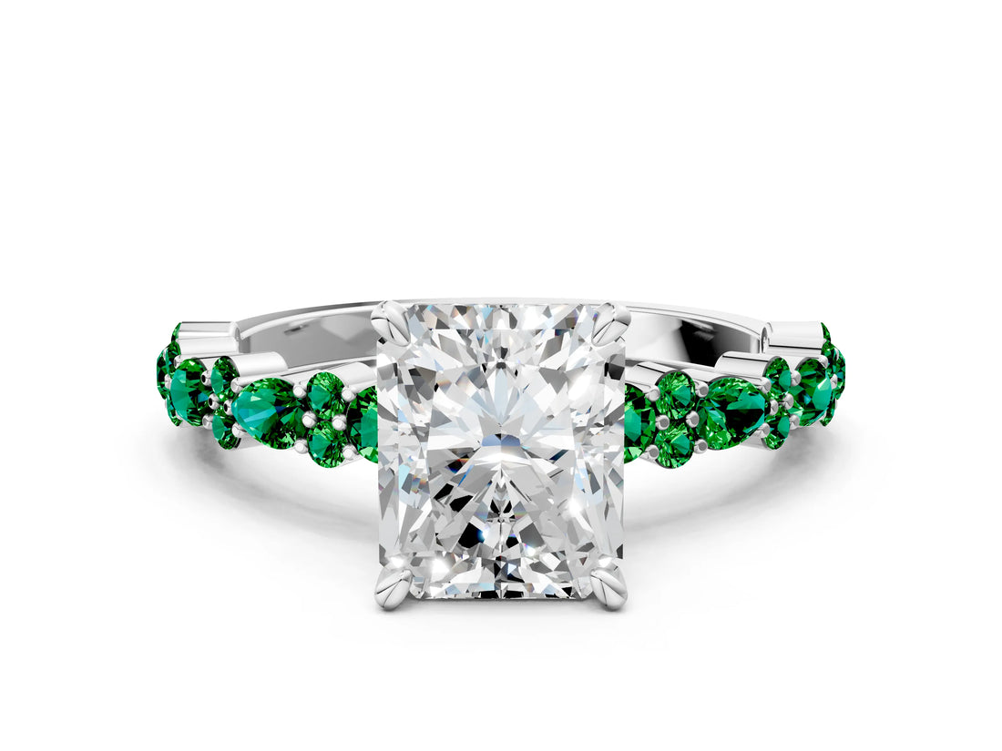 White gold Radiant Cut Diamond Side Stone Solitaire Ring with Round with Emerald side stone and Four-Prong Setting